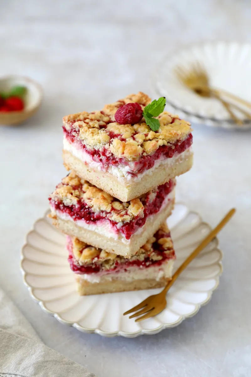Carrés crumble cheesecake aux framboises