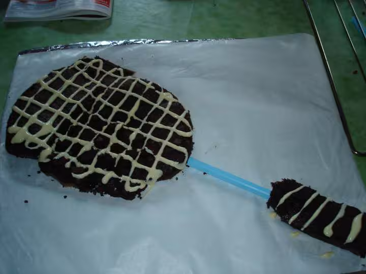 Ca devait ressembler a une raquette de badminton