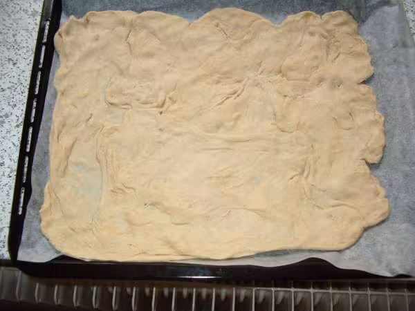 Pate a pizza en cours de levee