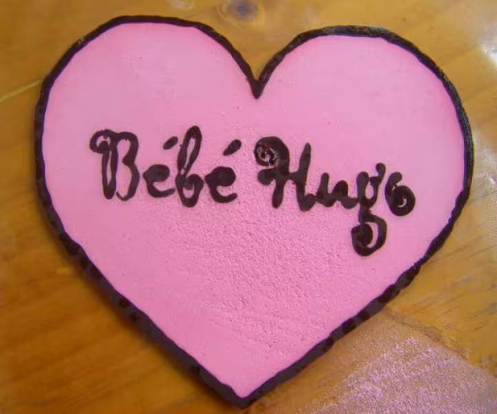 Gacage bebe hugo coeur choc noir et sucre glace colore