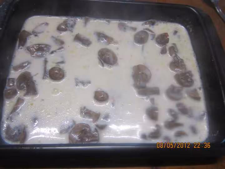 Escalopes de porc gratinees sauce bechamel champignons