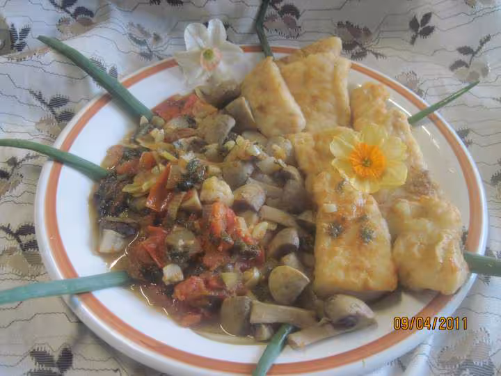 Filets de poisson aux legumes en sauce