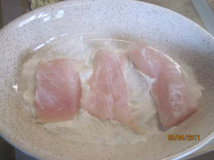 Filets de poisson aux legumes en sauce