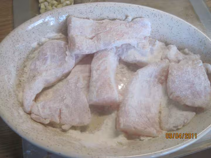 Filets de poisson aux legumes en sauce