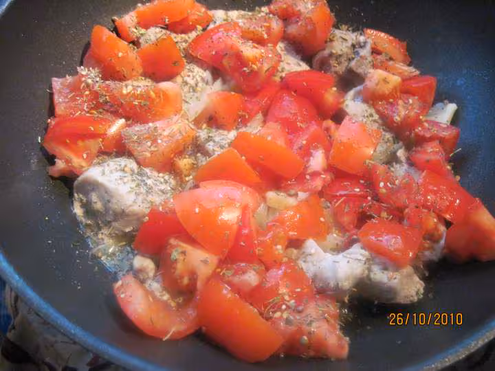 Saute de porc au riz en sauce tomates au vin