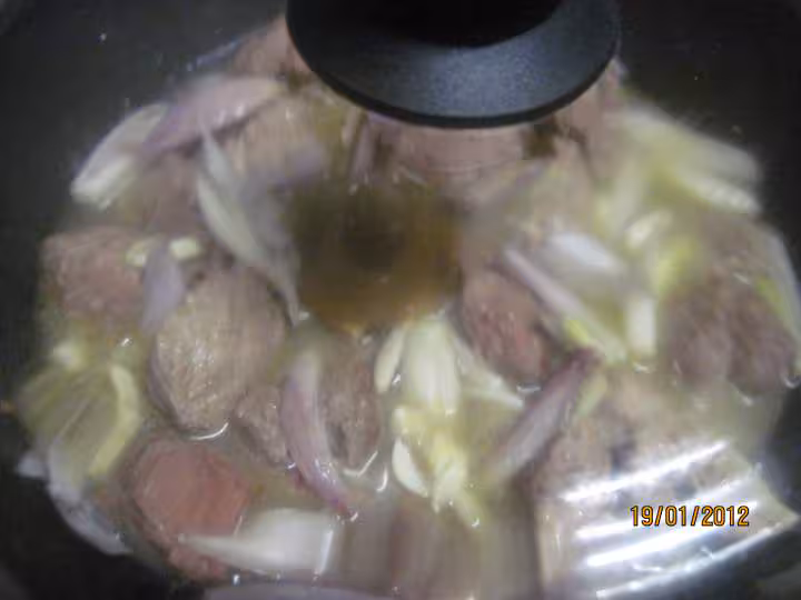 Saute de porc au trio de poivrons en sauce de vin
