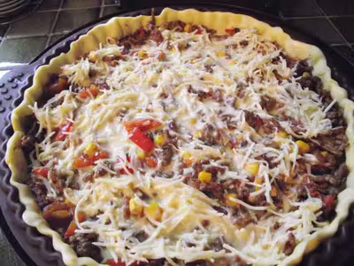Quiche mexicaine aux tomates, oignons et gruyère