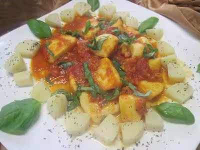 Lamelles d'encornets à la sauce tomate au vin blanc