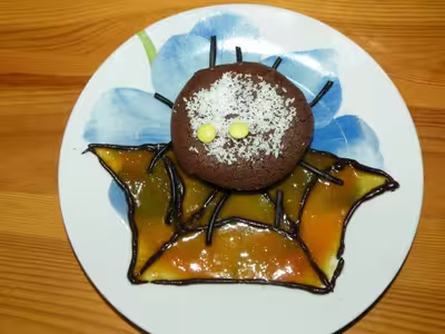 Araignée au chocolat sur sa toile à l'orange